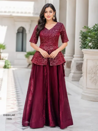 Georgette Sequins Embroidered Peplum Top with Shimmer Organza Lehenga.